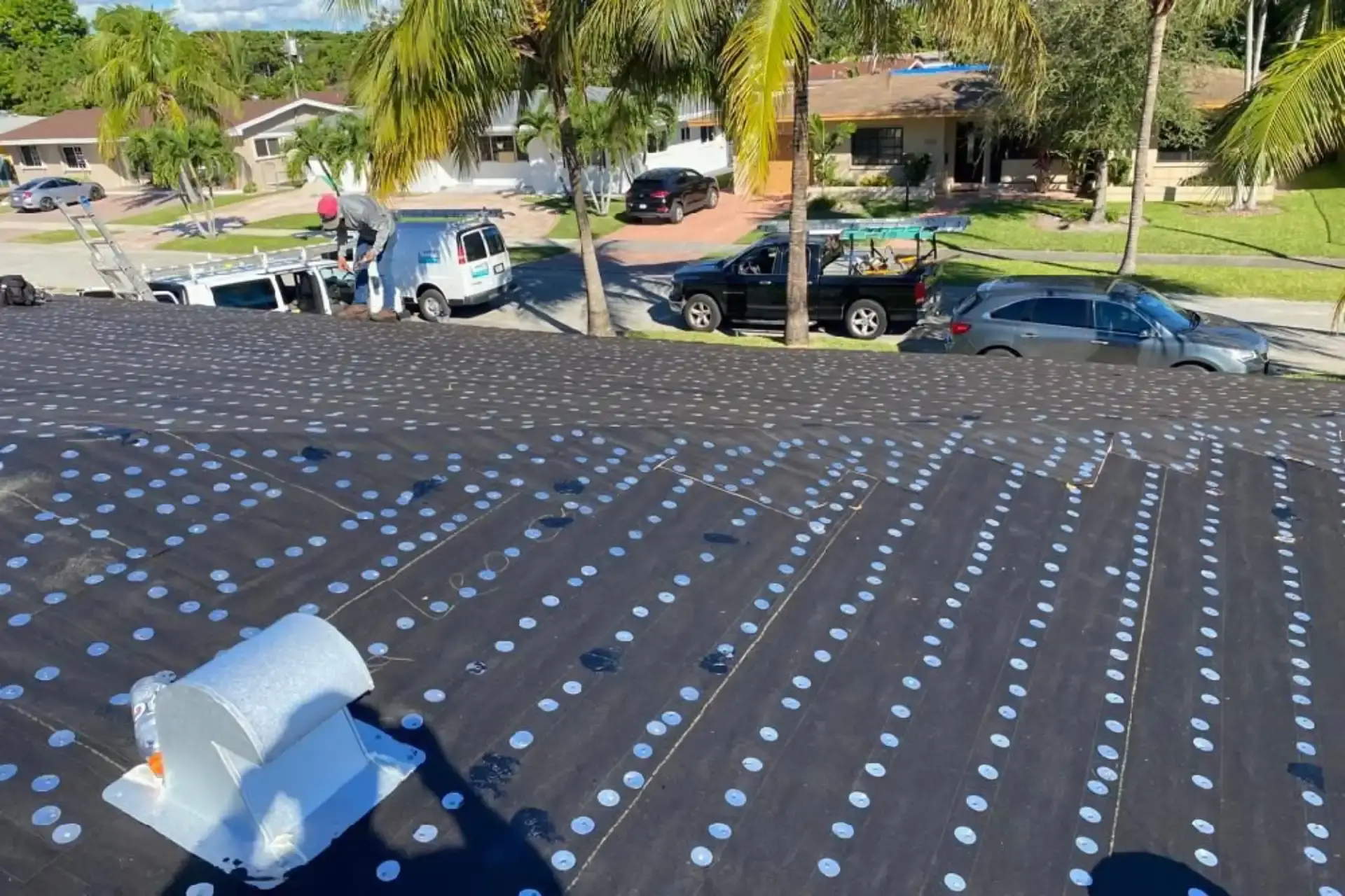 Roof deck dried in with underlayment and cap fasteners before the finish material goes down