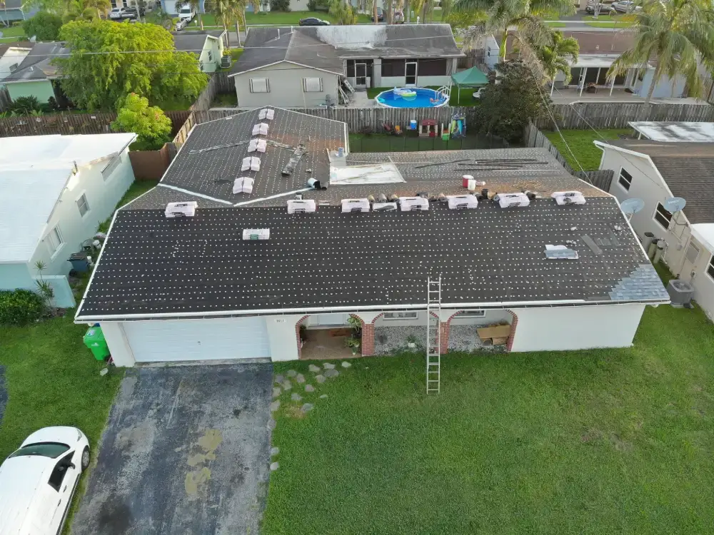 Drone view of a completed shingle roof replacement in Broward County